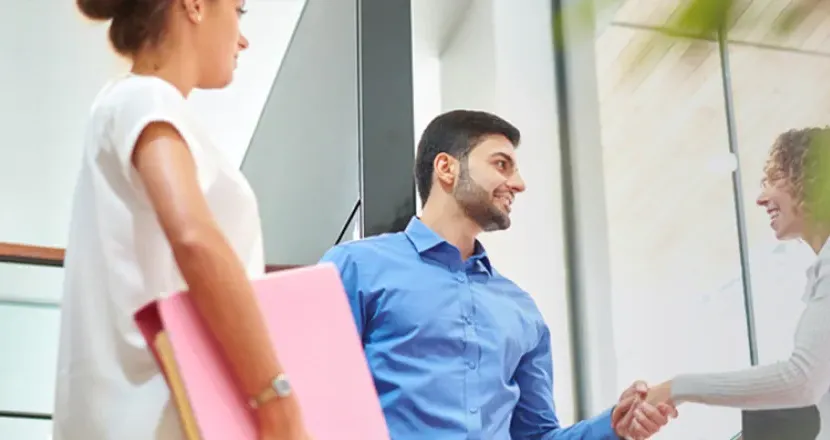 Business Entrepreneurship Bachelor Degree Program Graduate Shaking Hands with Operations Manager